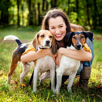 a-women-hug-our-dogs