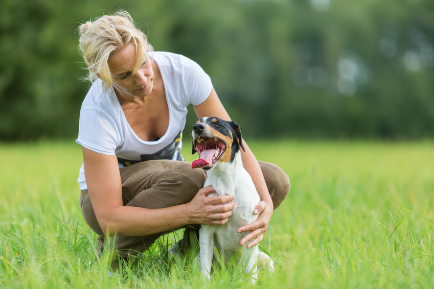 women with dog in garden